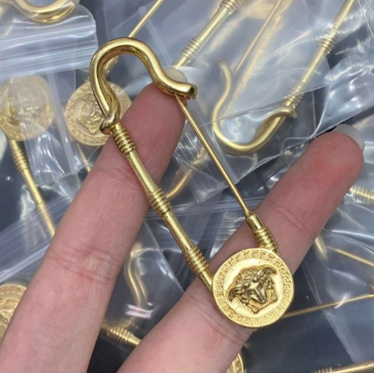 Versace brooch