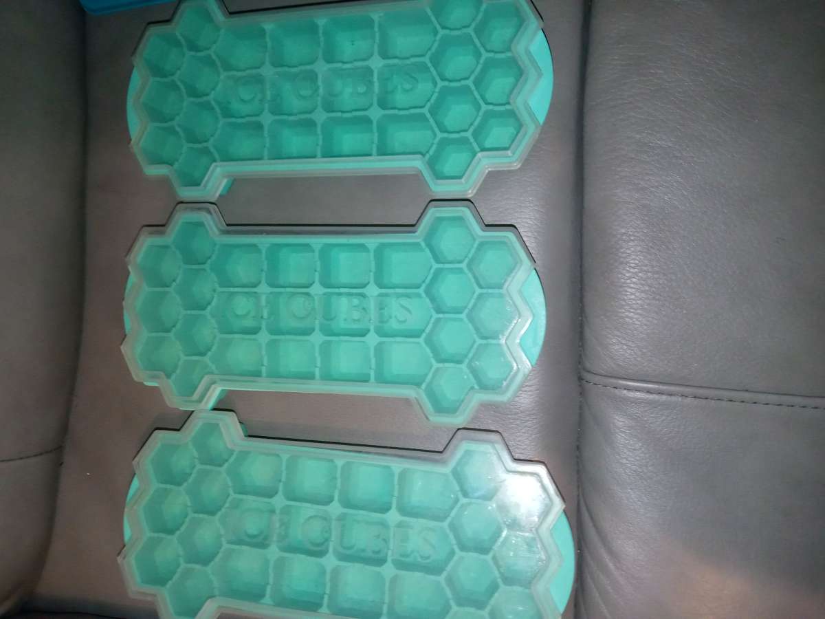 three honeycomb ice Cube mold trays with lids to regular ice