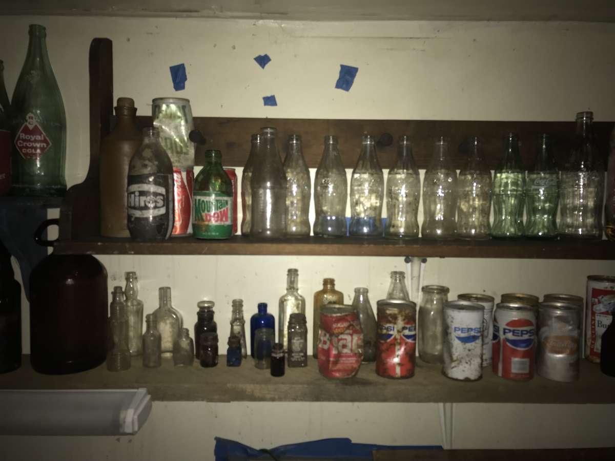 old soda bottles and beer bottles and others