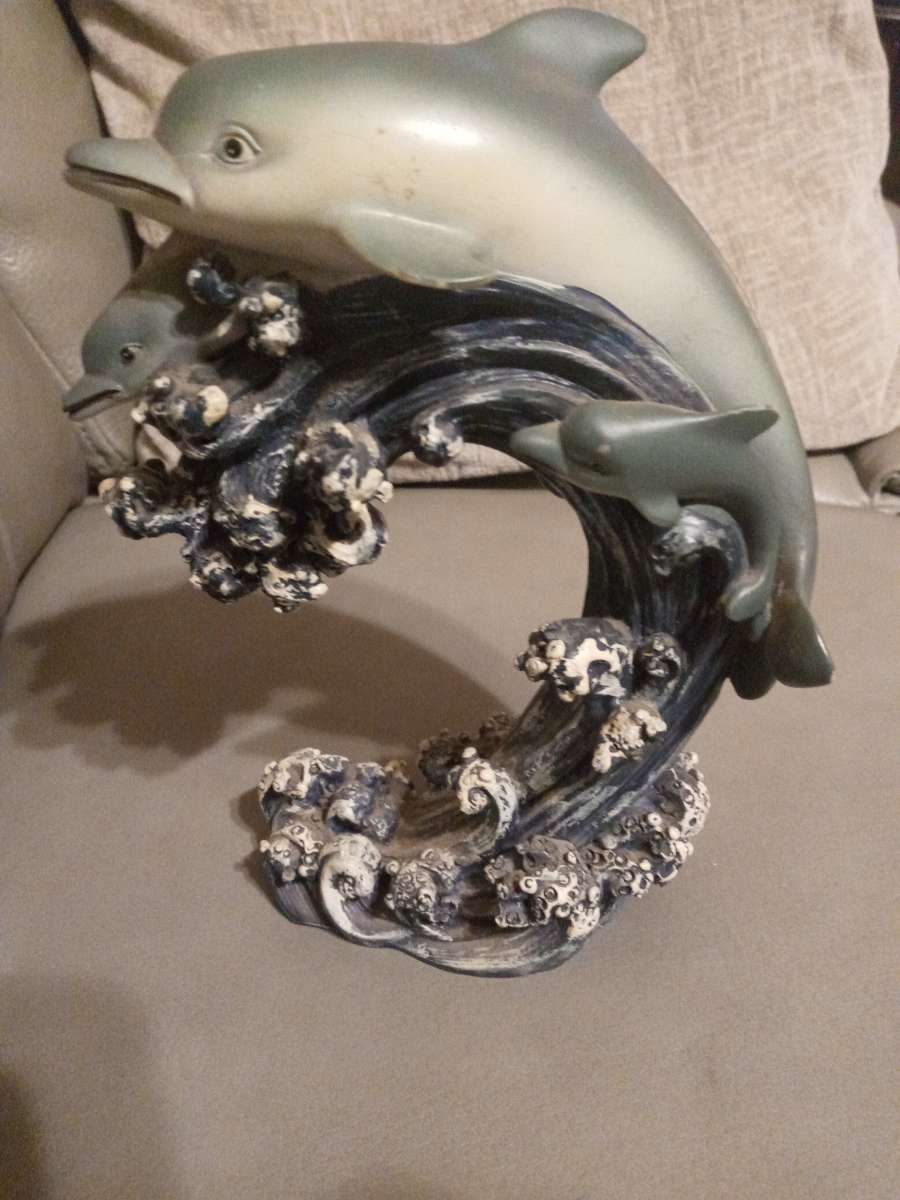 two dolphins in the ocean figurine