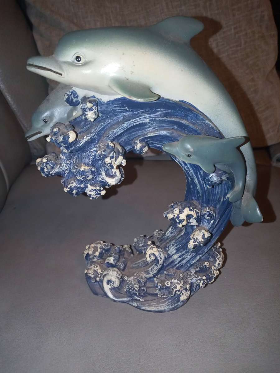 two dolphins in the ocean figurine