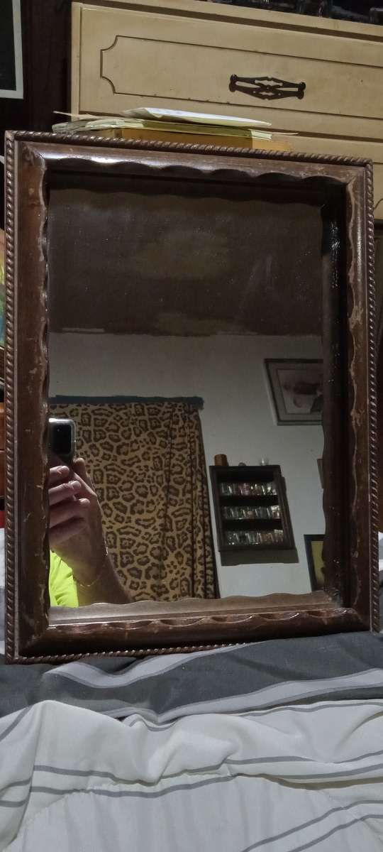 wood mirror ornate detailing