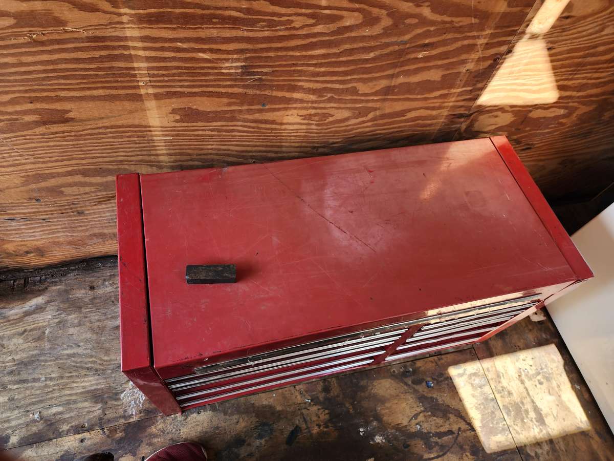 large top and bottom box full of tools