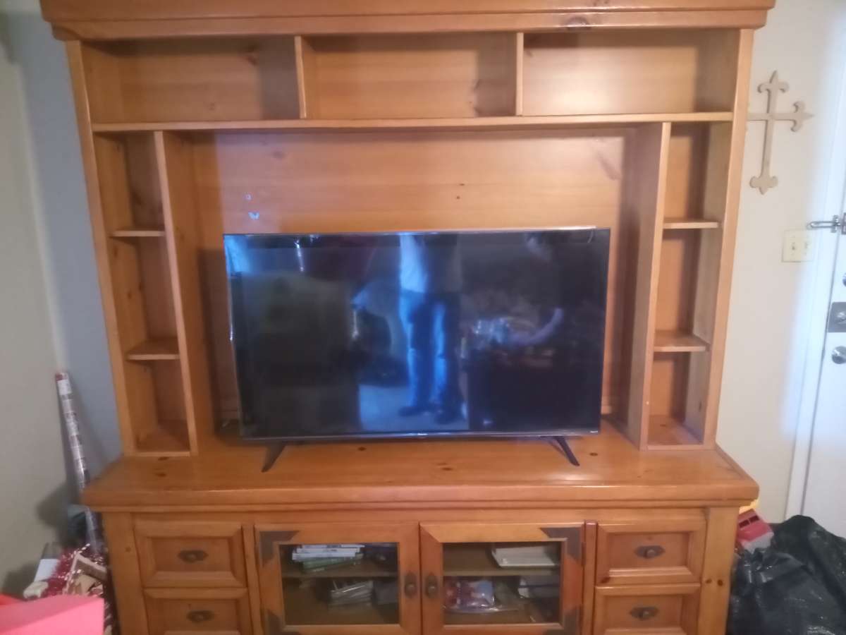 solid wood entertainment center with two end tables