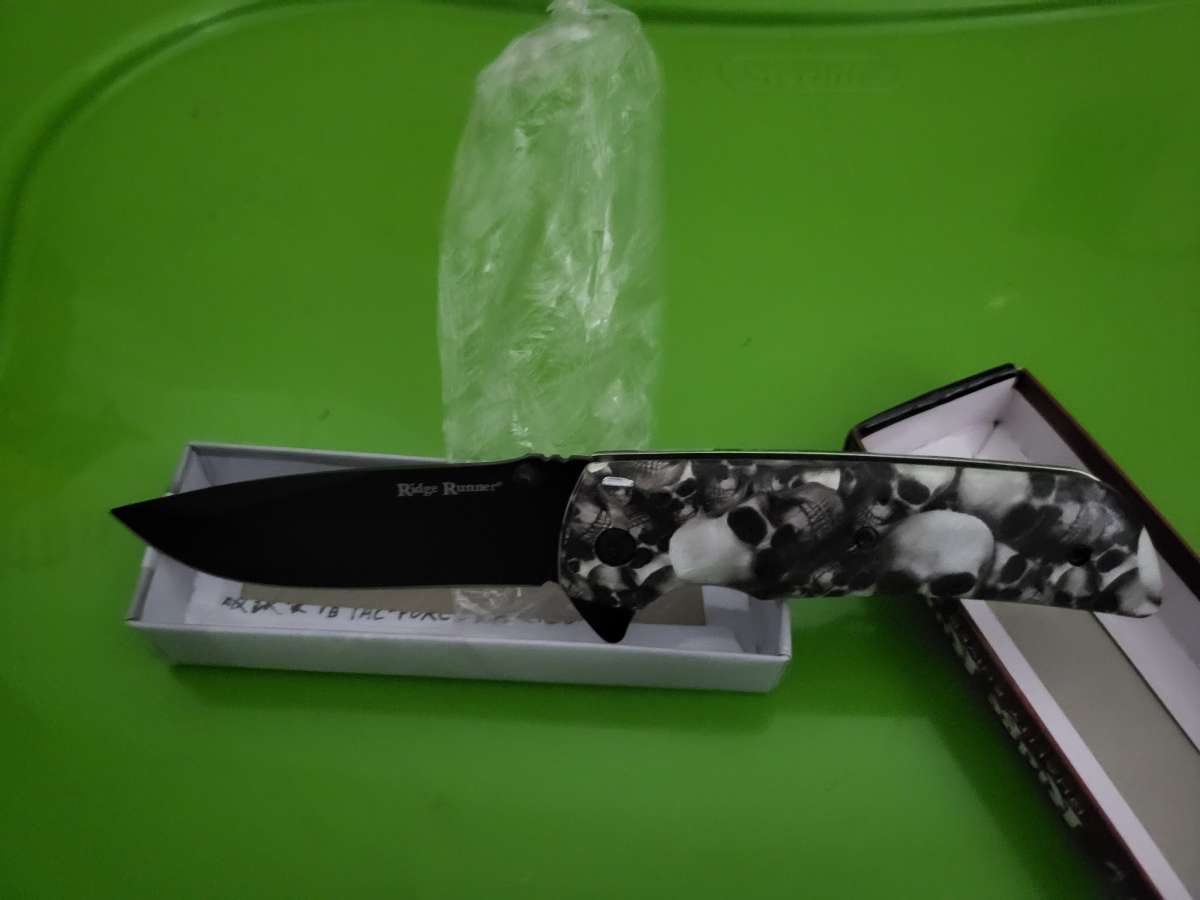 skeleton head spring assist knife