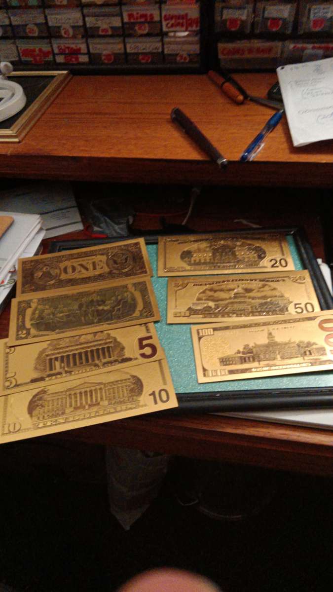 Set of Seven Commemorative Golden Bills covered with gold