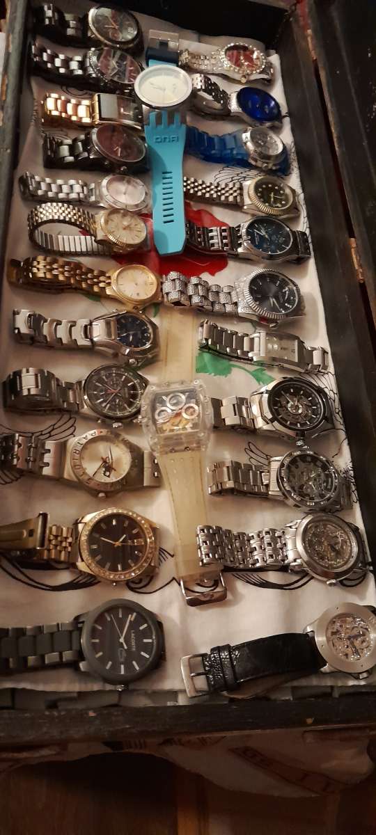 watch collection includes invicta guess Ellen Movado rolex