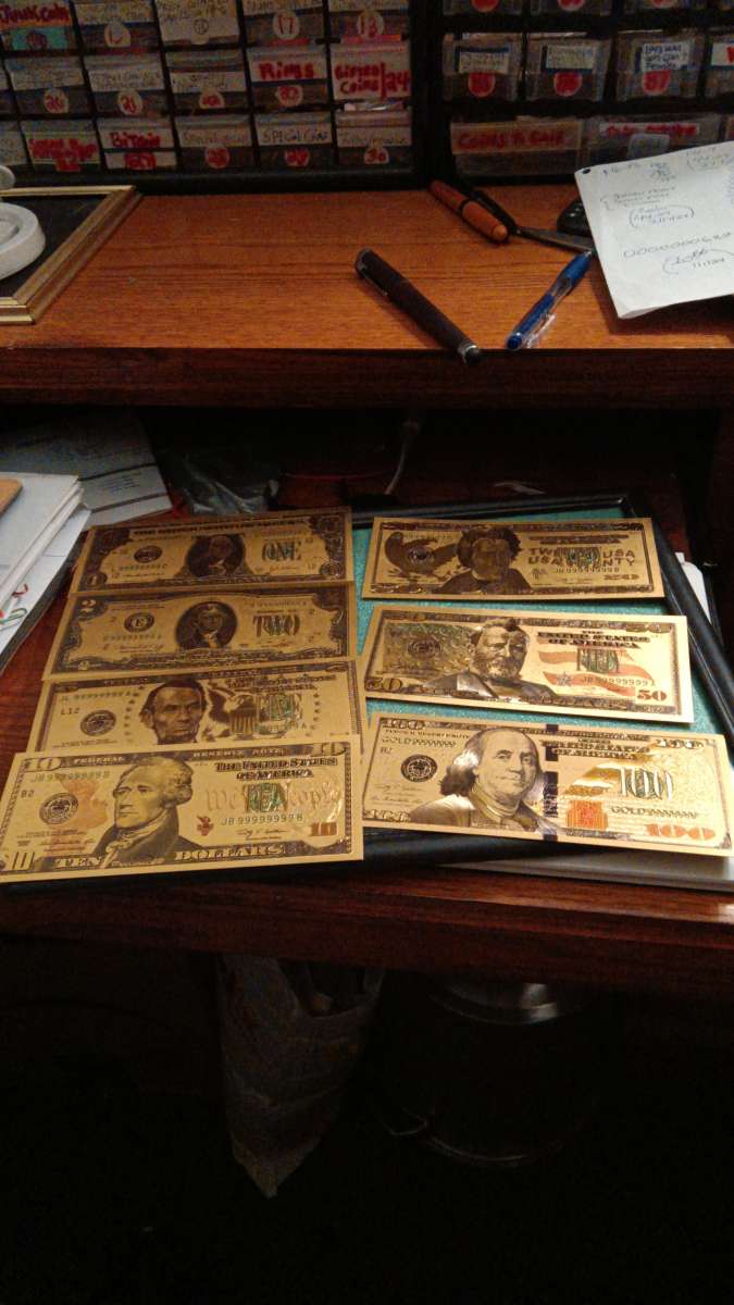 Set of Seven Commemorative Golden Bills covered with gold