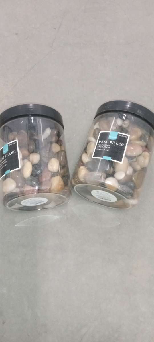 2 plastic boxes of river stones