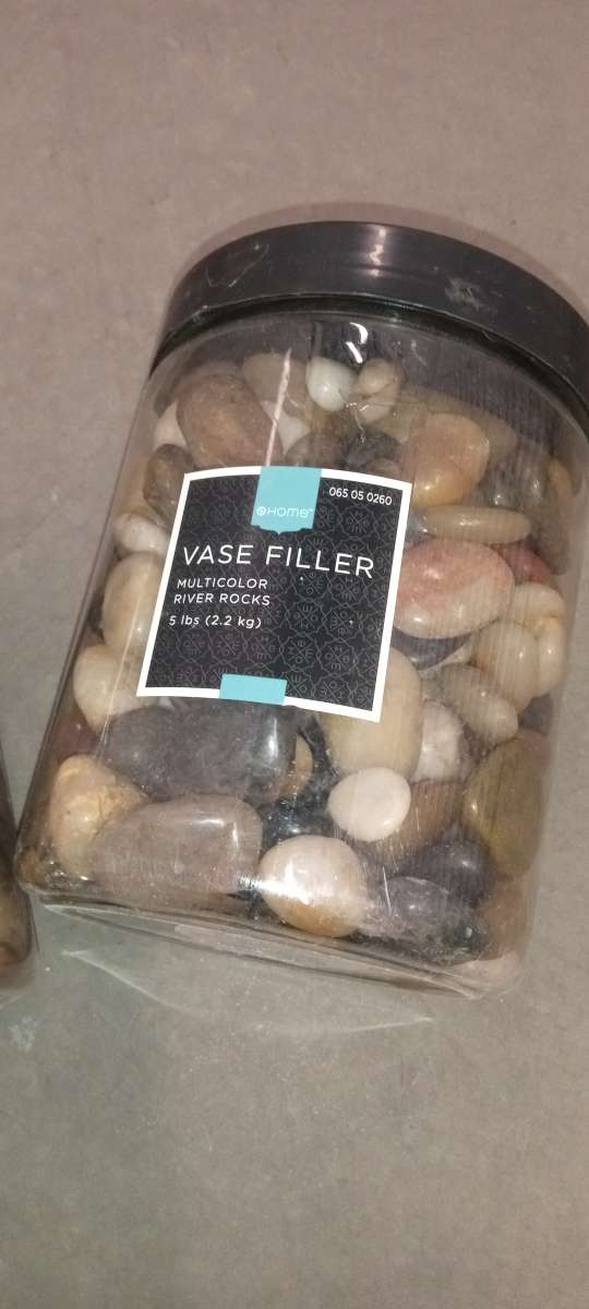 2 plastic boxes of river stones