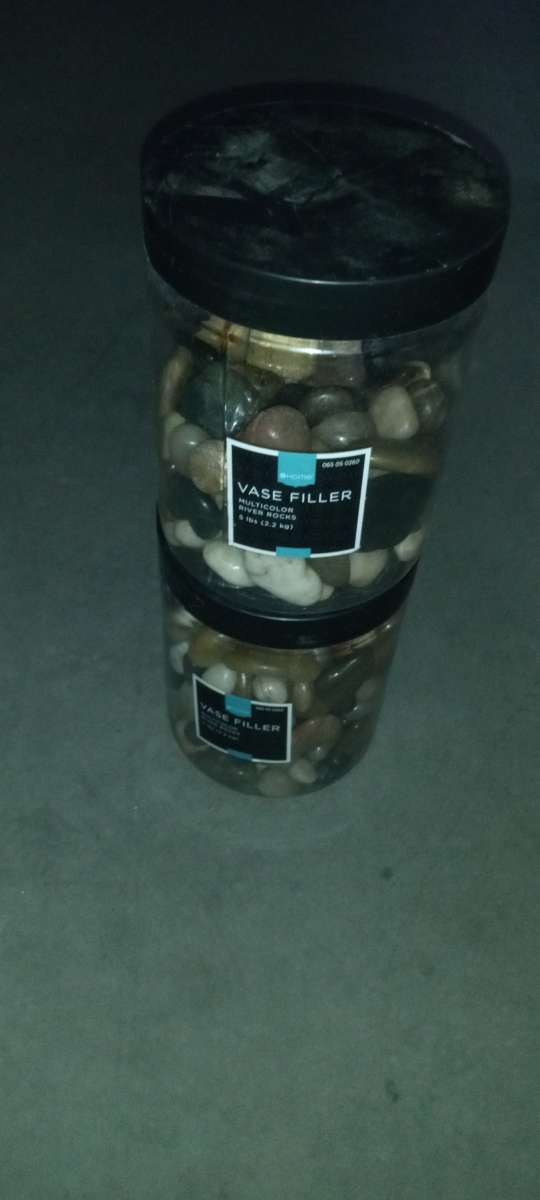 2 plastic boxes of river stones