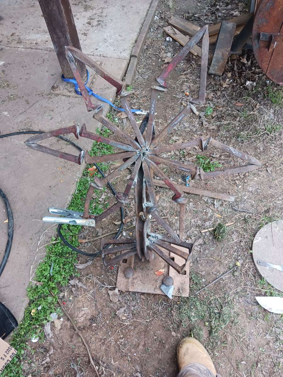 yard art flower made it out of train track spikes 65 for it