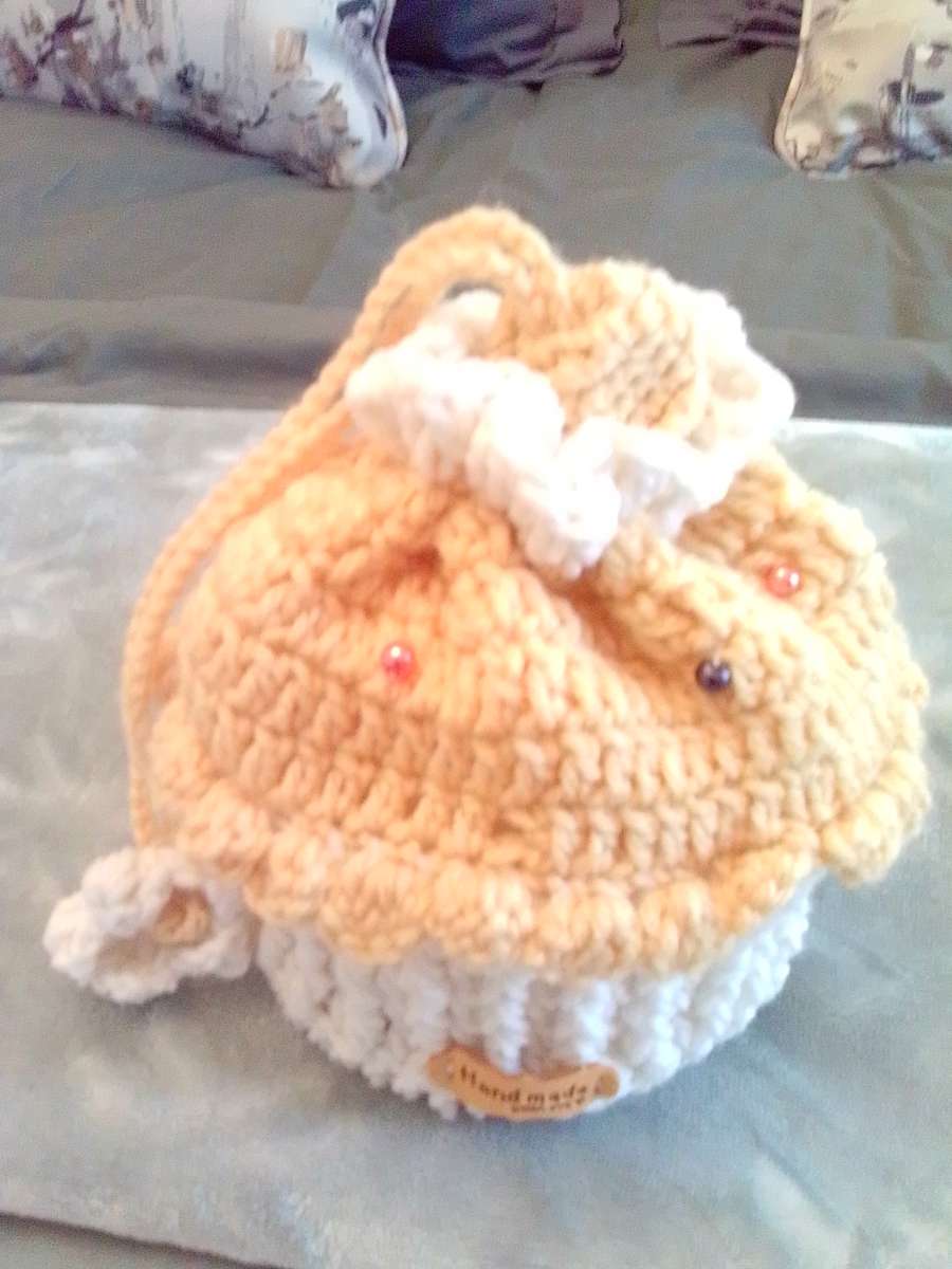 crocheted yellow cupcake pouch