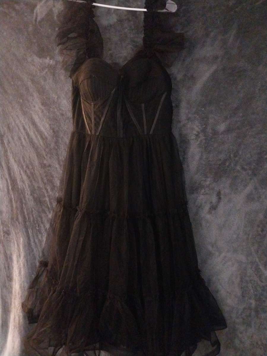 Corset style Corset is see thru around the bust