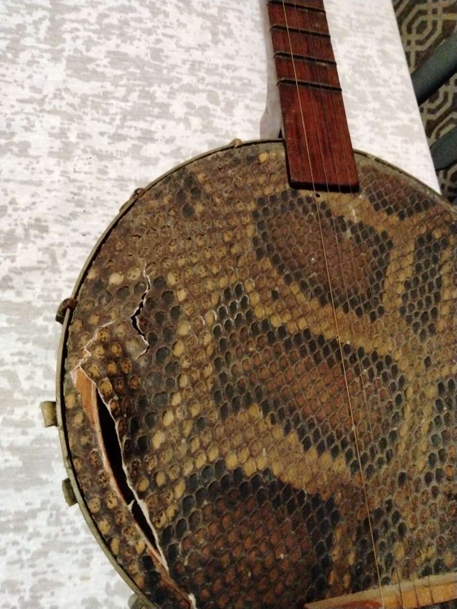 old Chinese banjo needs mending