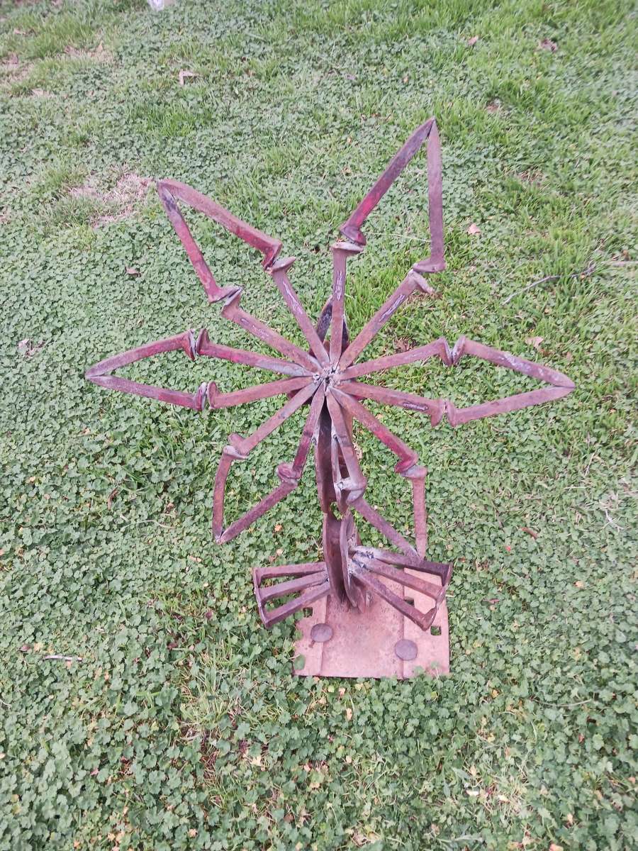 yard art flower made it out of train track spikes 65 for it