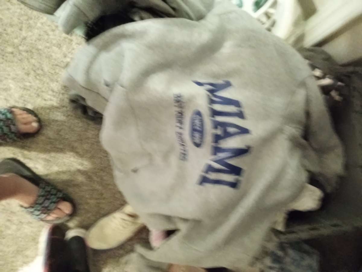 bucket full of gently worn clothing items size med to lrg