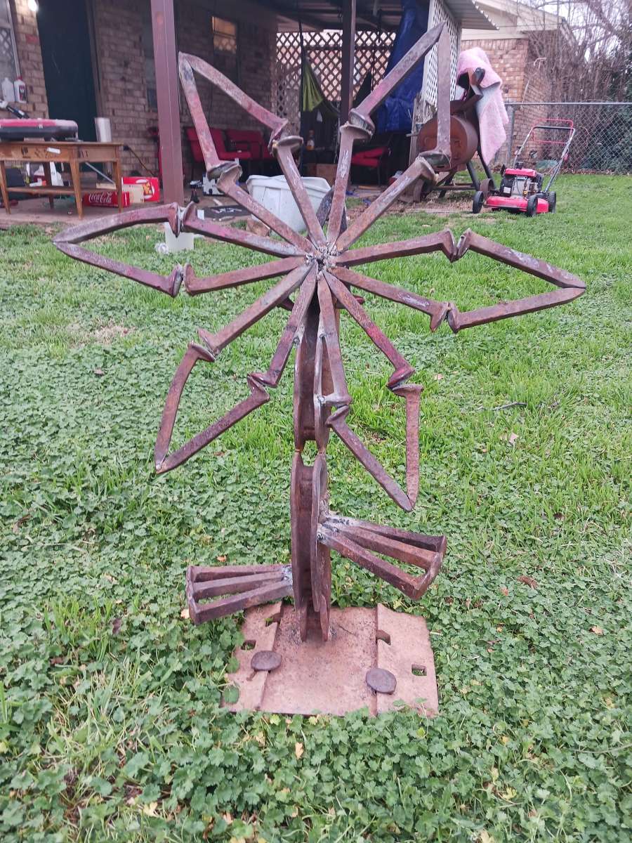 yard art flower made it out of train track spikes 65 for it