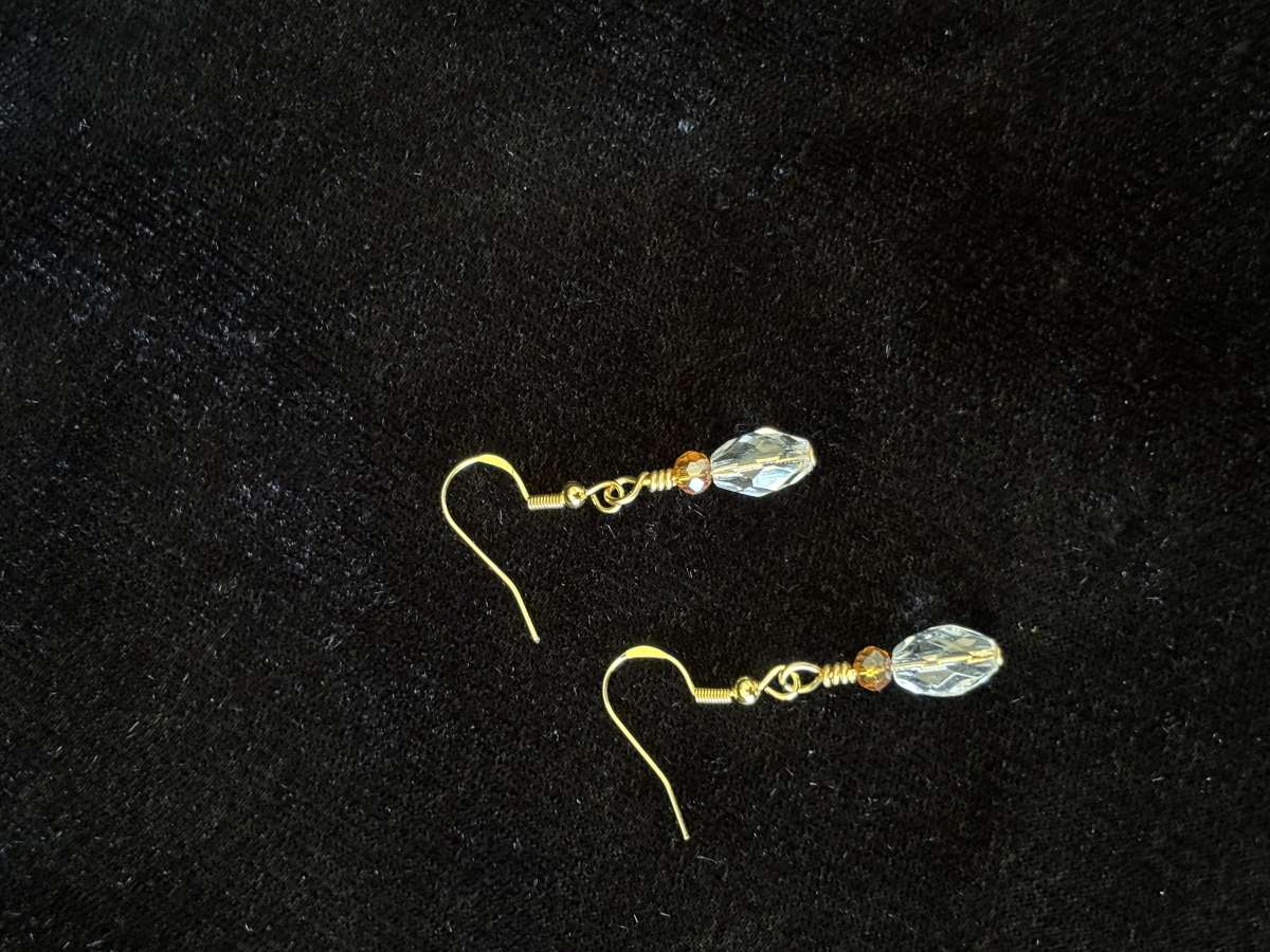 ambler and clear glass bead dangly earrings