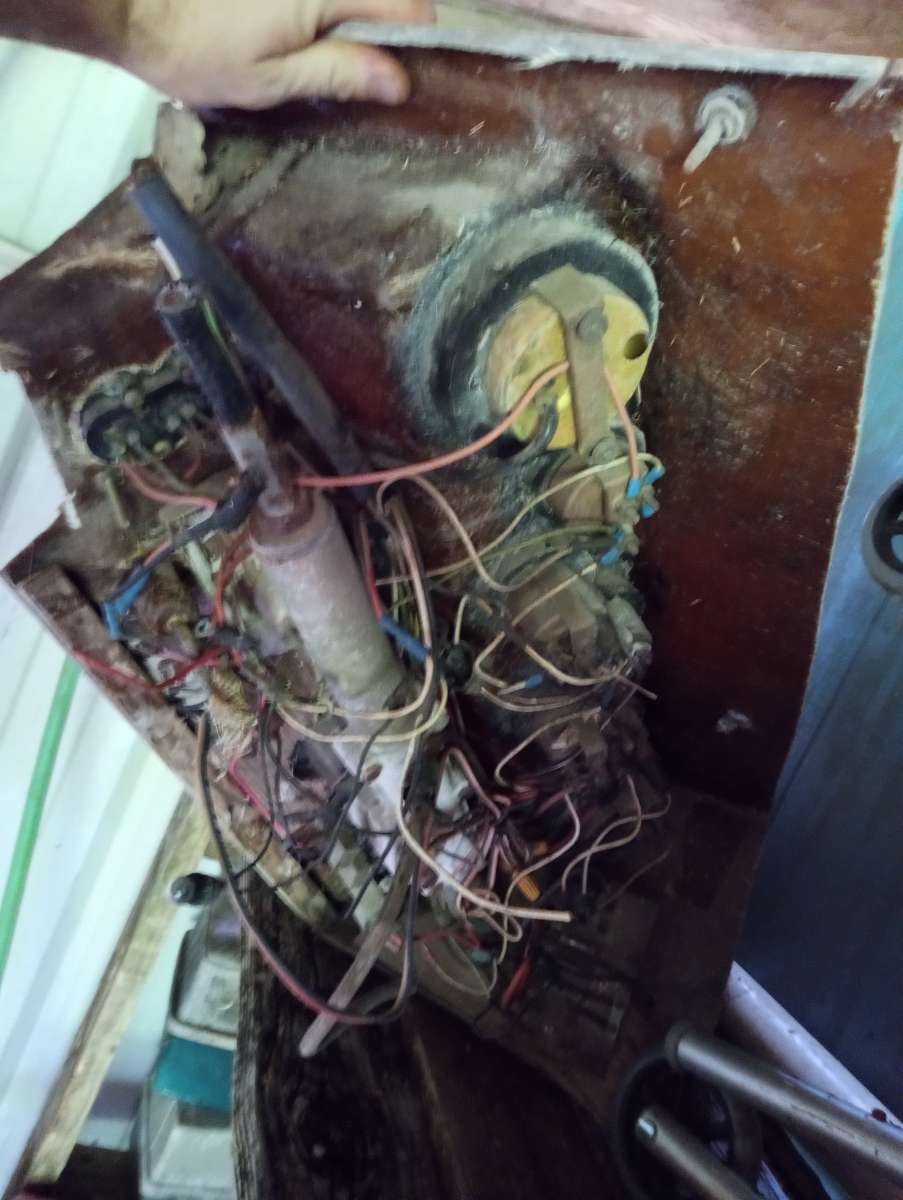 old boat parts and fishing poles and tackle