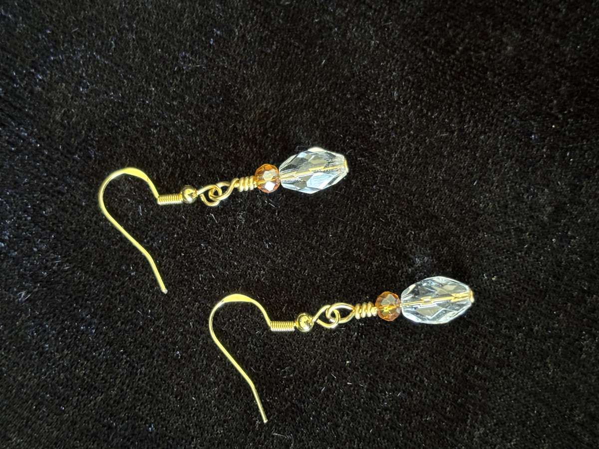 ambler and clear glass bead dangly earrings
