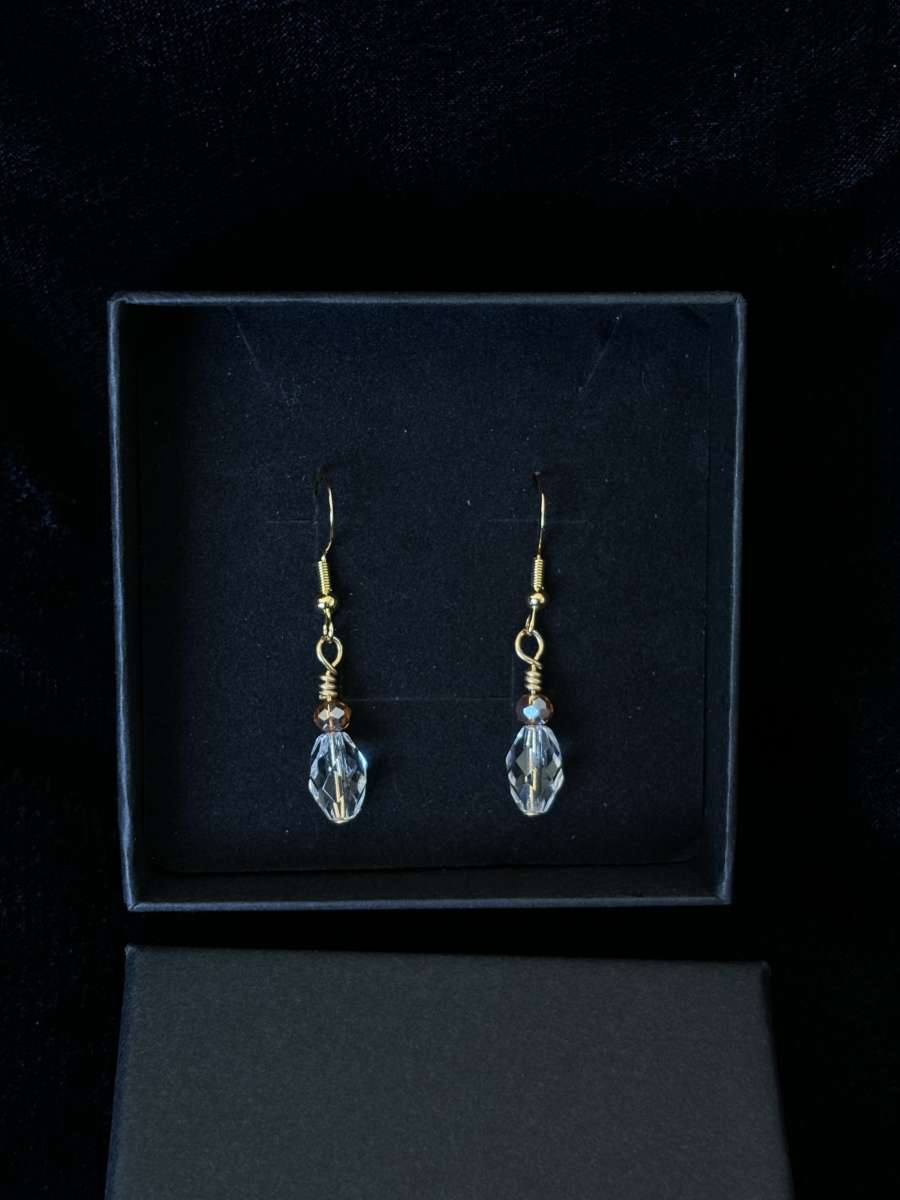 ambler and clear glass bead dangly earrings