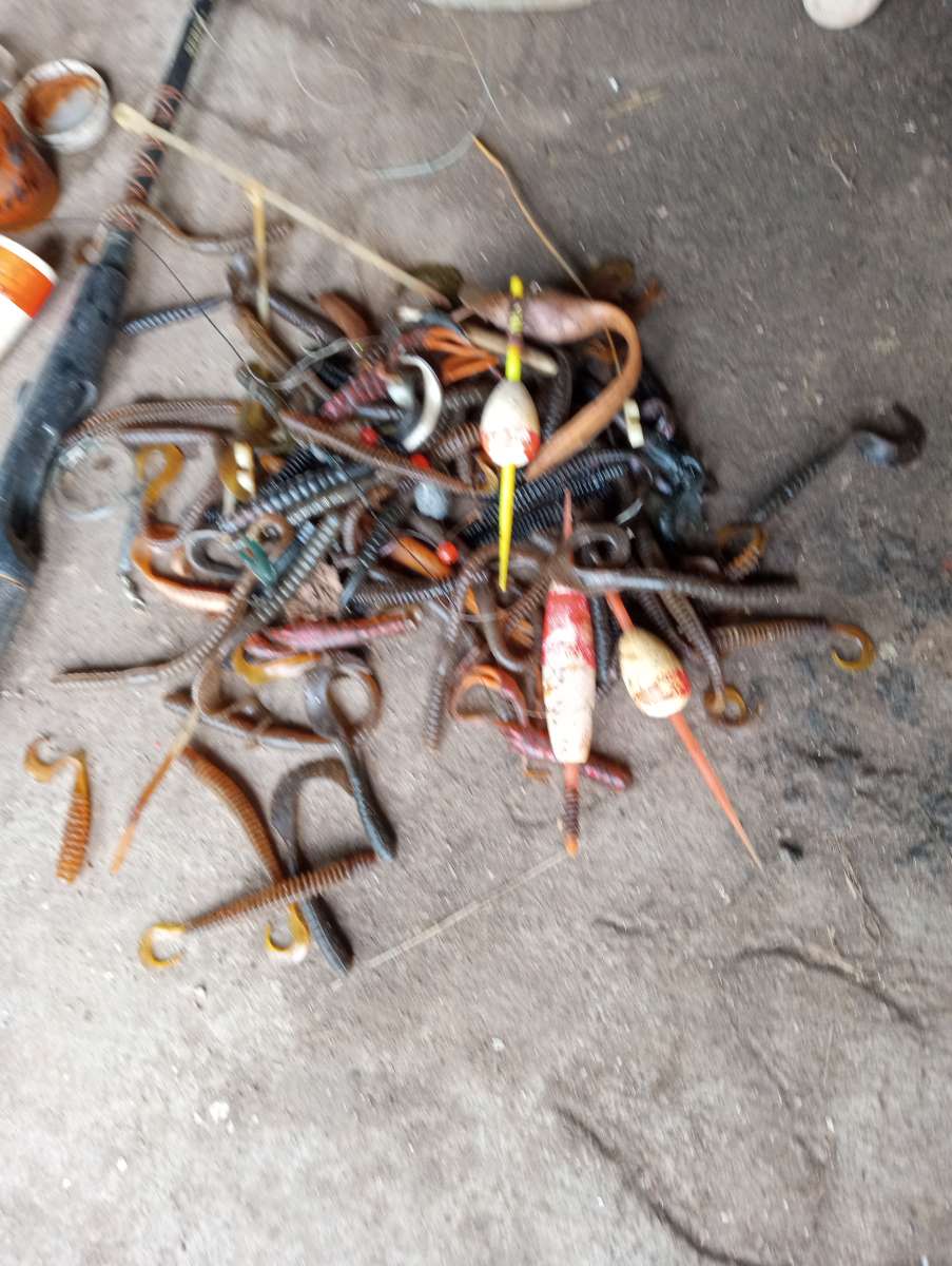 old boat parts and fishing poles and tackle