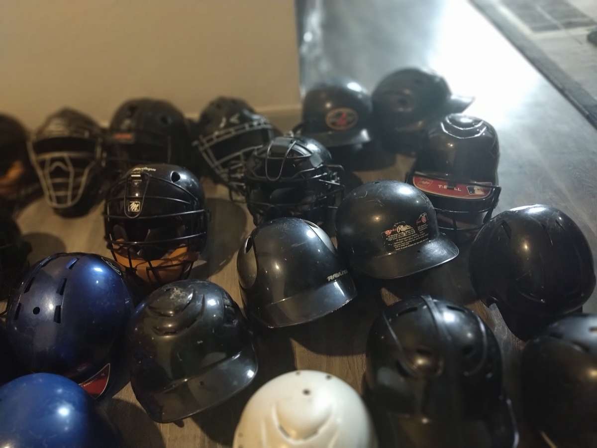 little League catcher gear baseball bats and helmets