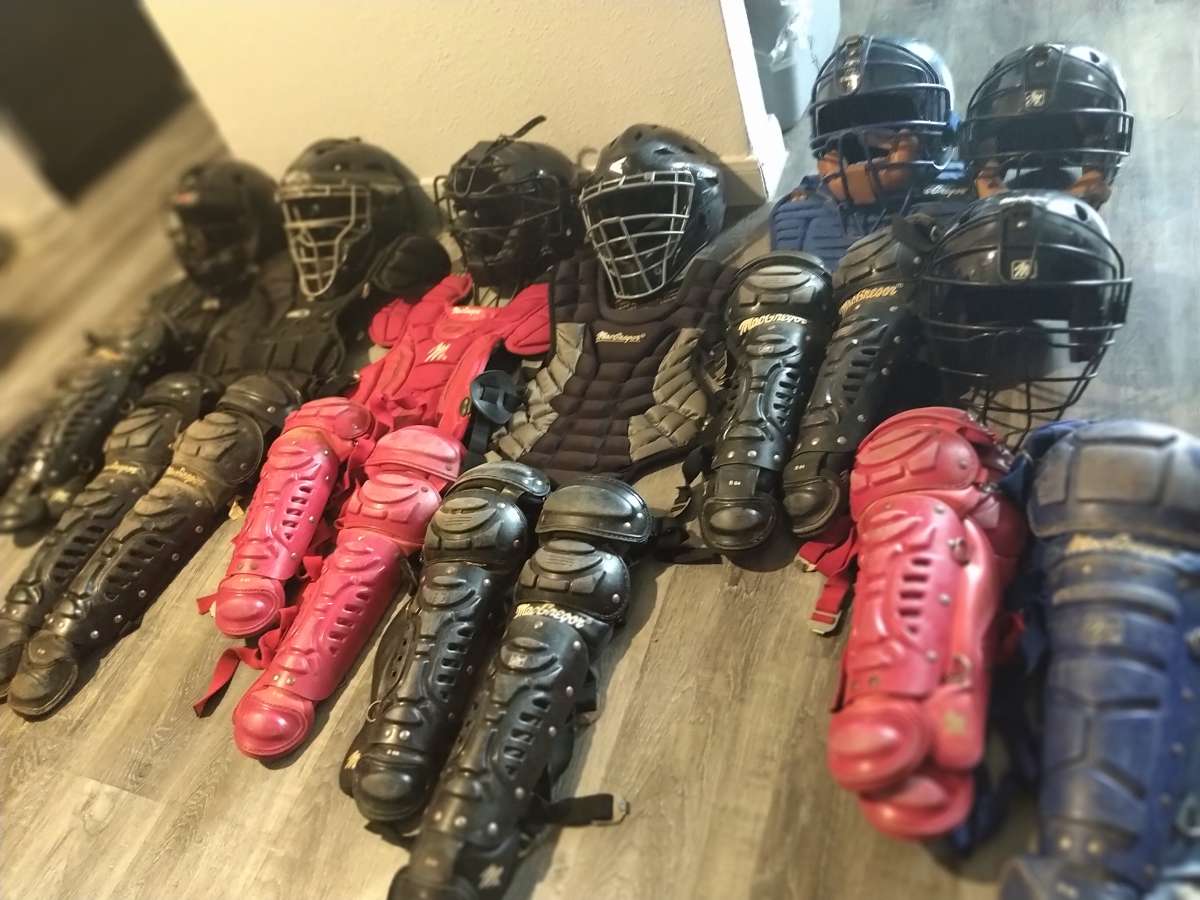 little League catcher gear baseball bats and helmets