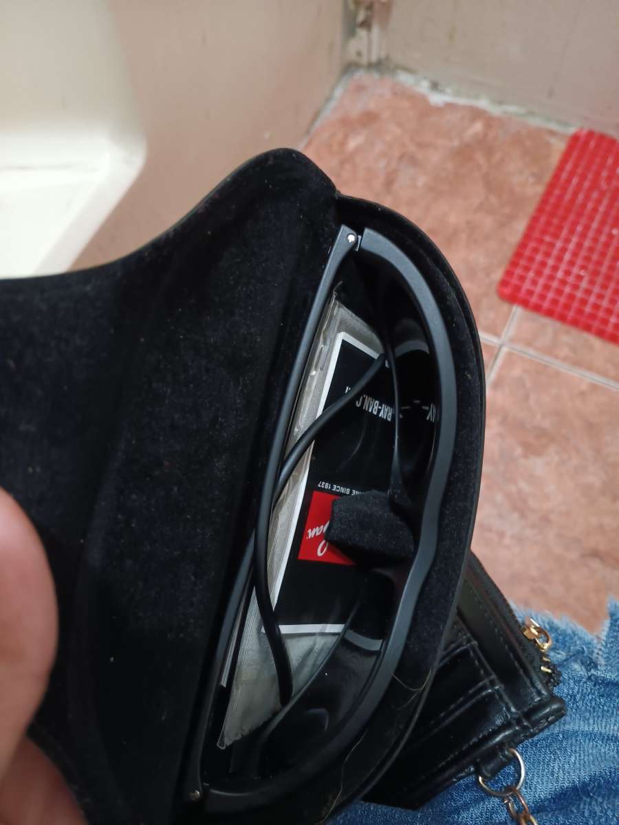 ray bans glasses and a old nintendo gameboy