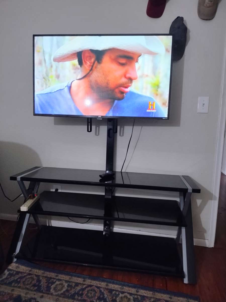 2 45 inch TVs and stand with remote controls