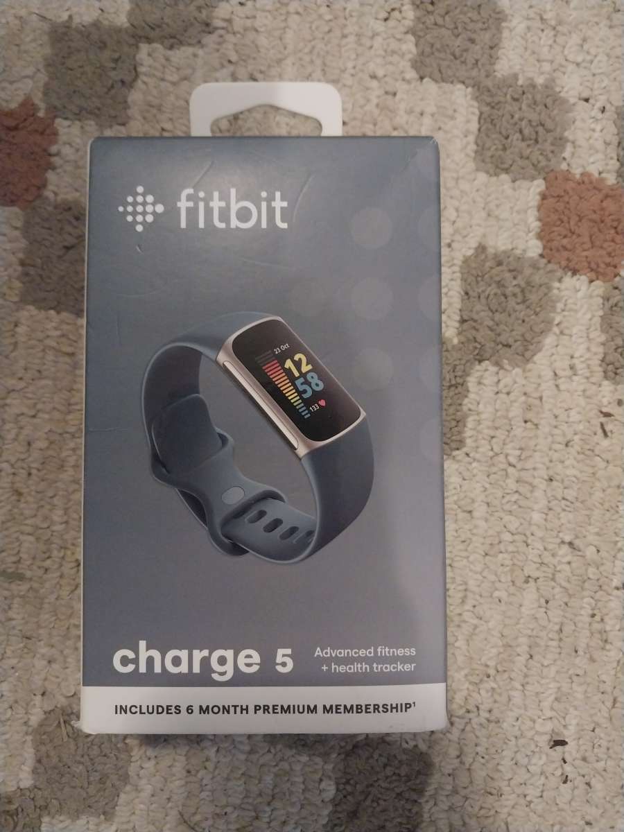 Brand New Fitbit Change 5 smartwatch with a extra