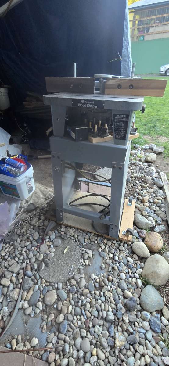 wood shaper with a bunch of bits