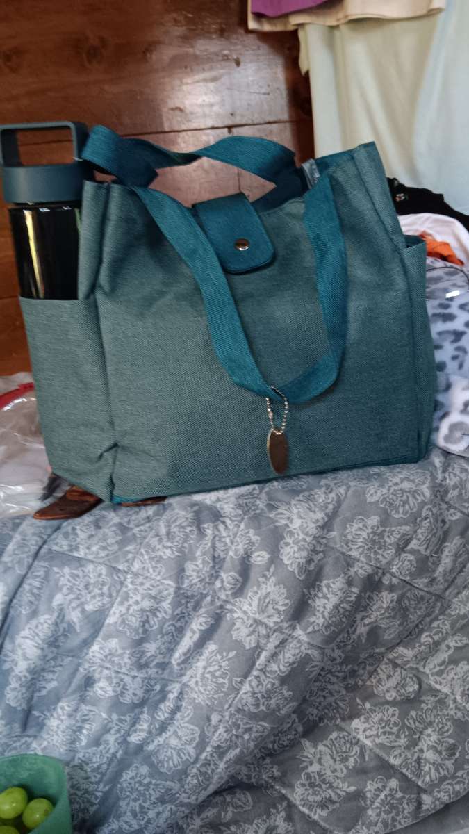 lunch bag with two containers and a drinking jar