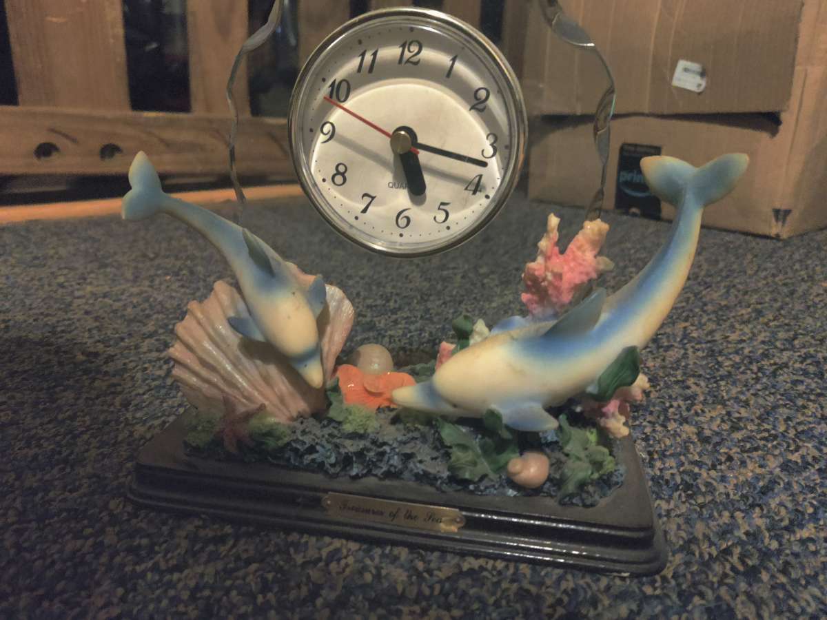treasures of the sea dolphin clock