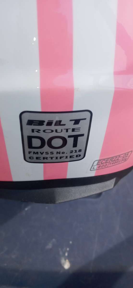 a pink DOT motorcycle helmet