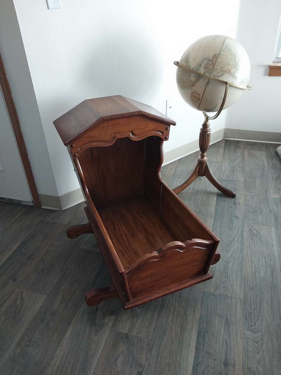 Hooded wooden rocking cradle