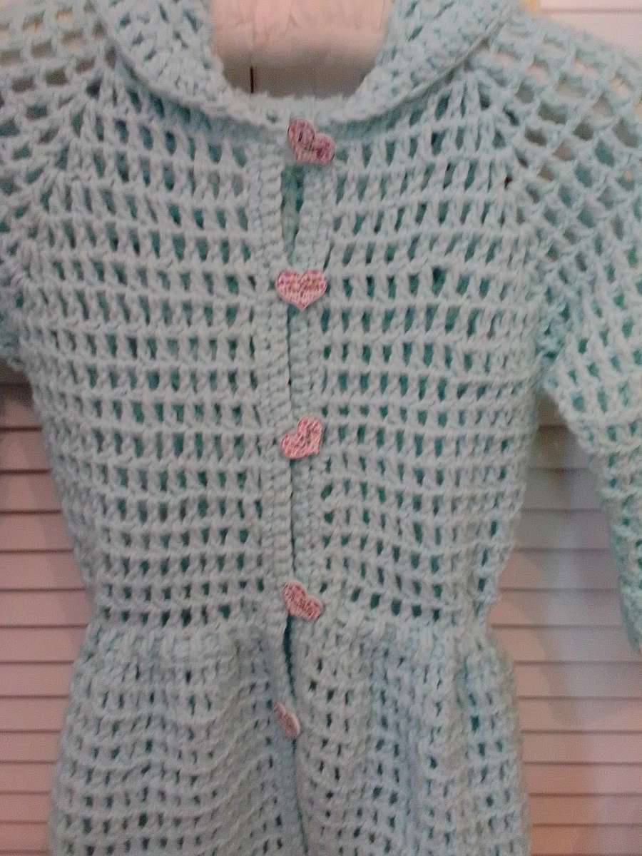 crocheted hoodie with puff flowers and heart wood buttons