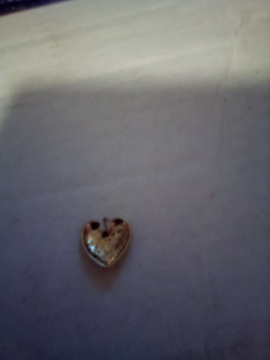 eartshape gold earrings with love written inside