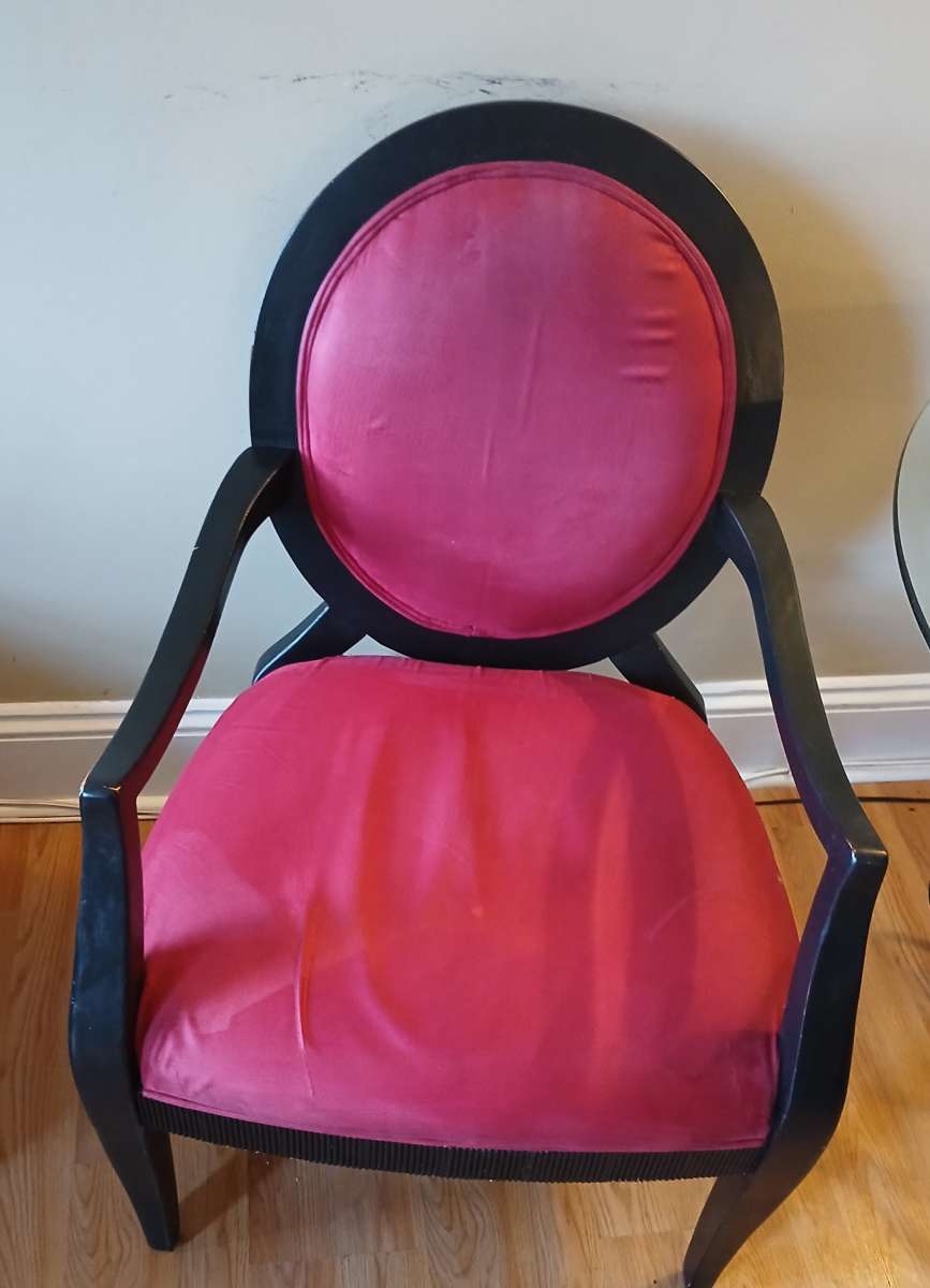 glass table with 2 red black vintage chairs