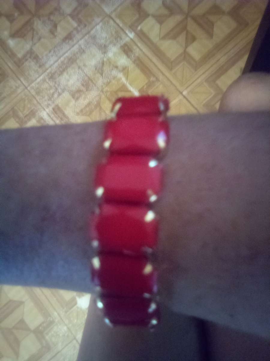 Stretchy gold bracelet with orange stones