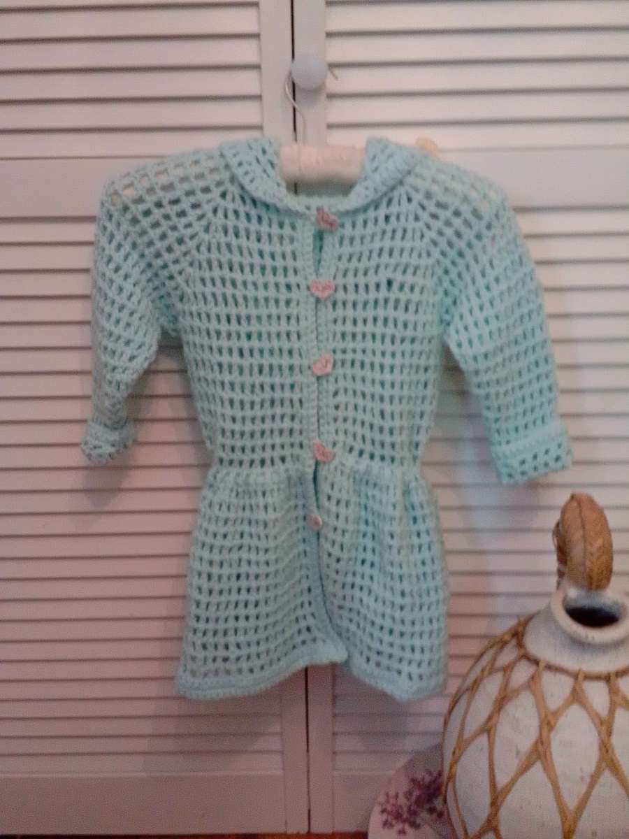 crocheted hoodie with puff flowers and heart wood buttons