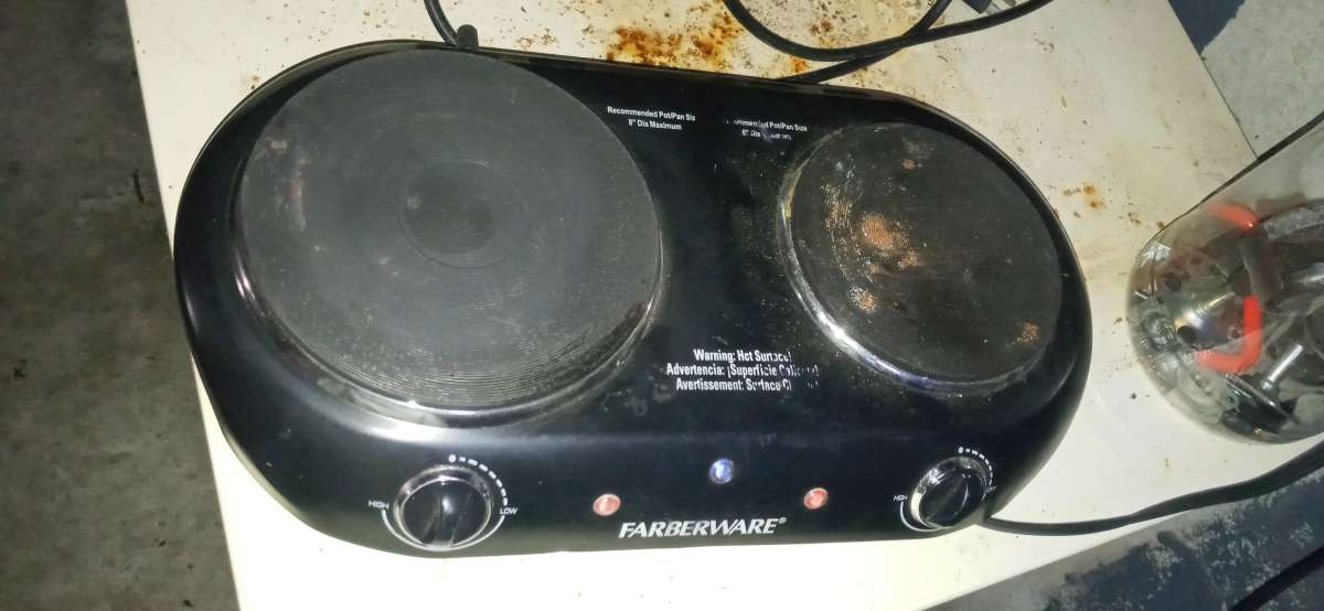 two pot plug in stove top and a flat skillet
