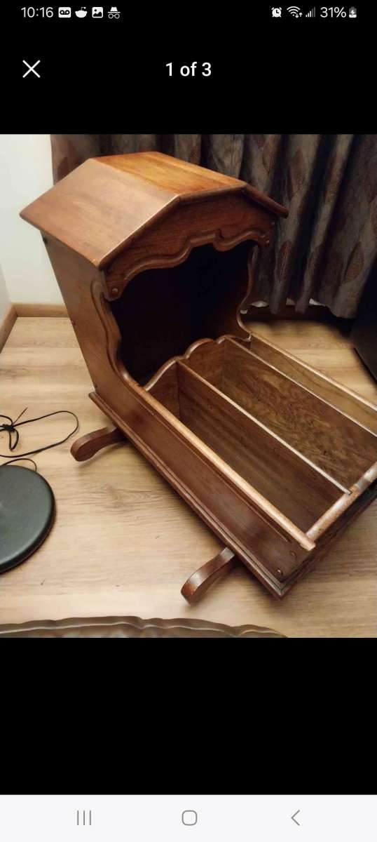 Hooded wooden rocking cradle