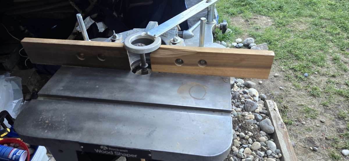 wood shaper with a bunch of bits