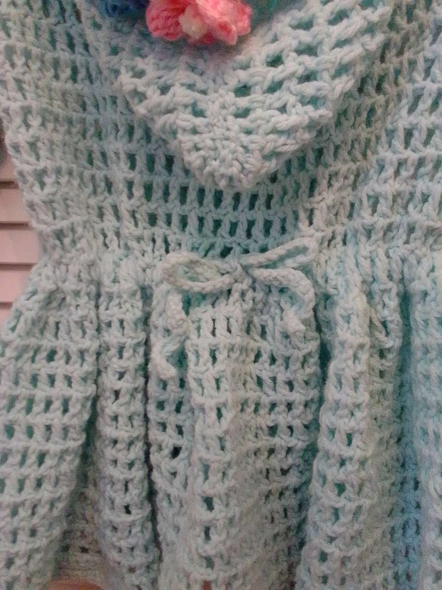 crocheted hoodie with puff flowers and heart wood buttons