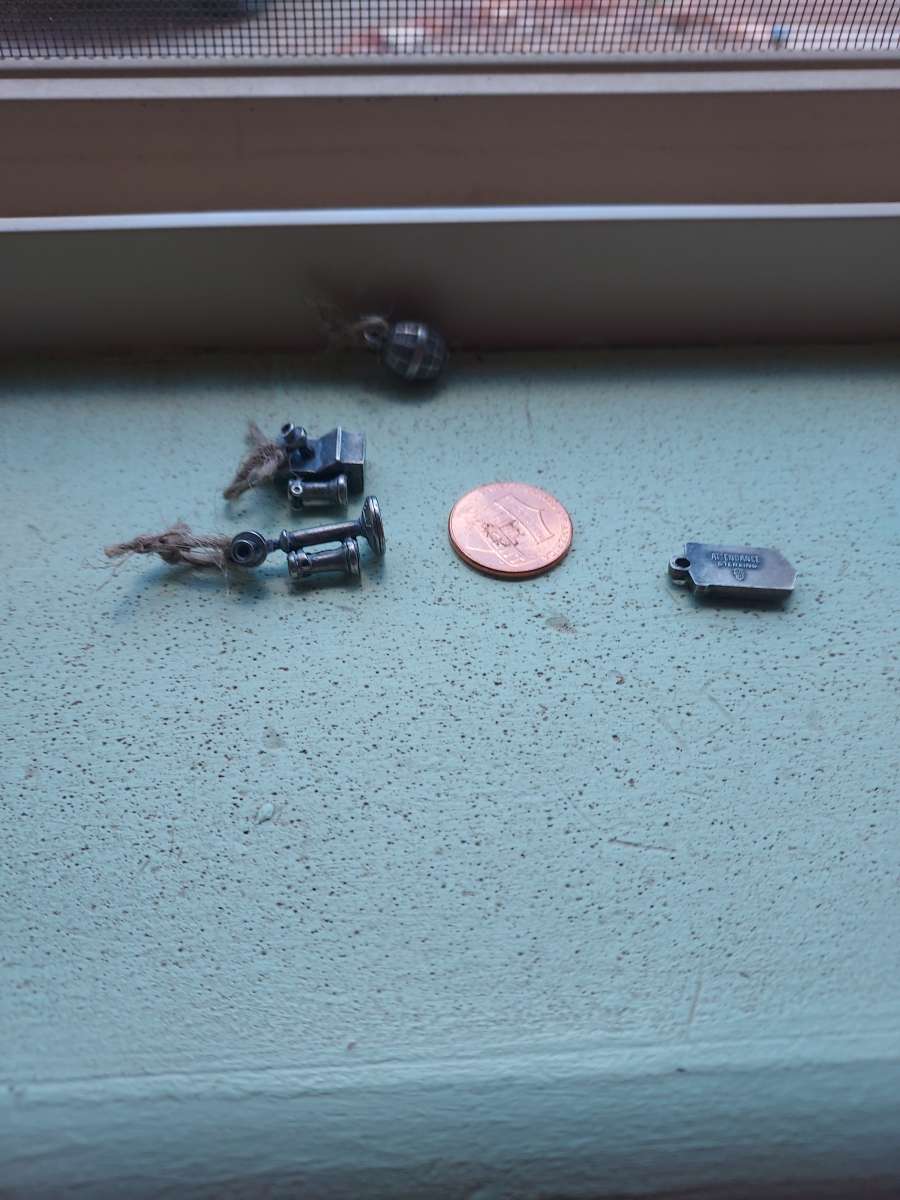 4 charms by the original BELL PHONE COMPANY