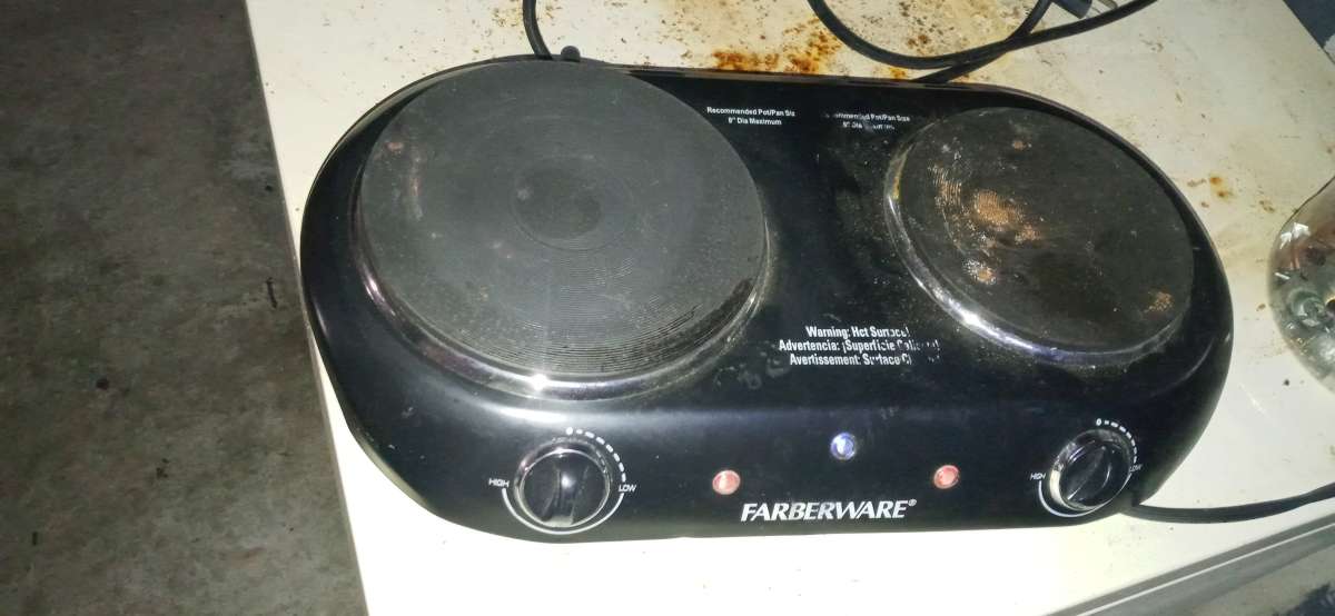 two pot plug in stove top and a flat skillet