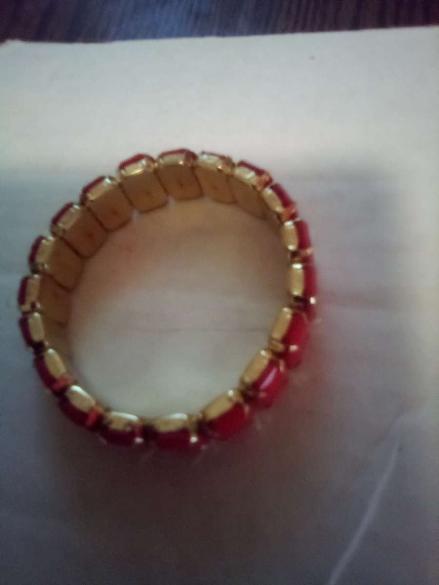 Stretchy gold bracelet with orange stones