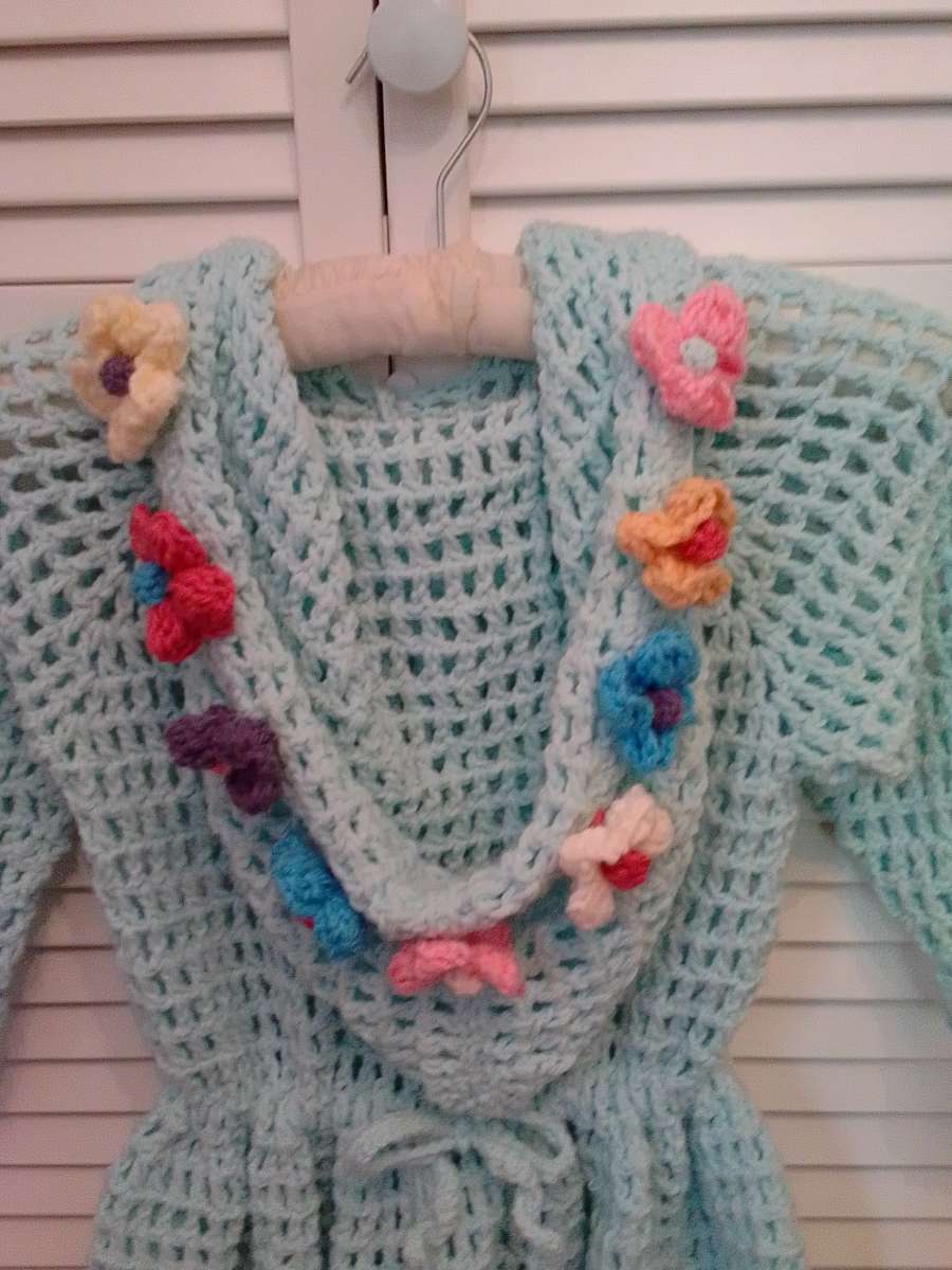 crocheted hoodie with puff flowers and heart wood buttons